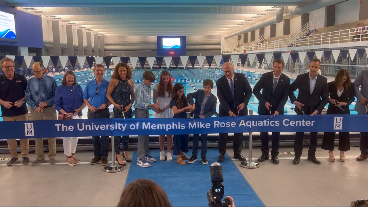 Ribbon cutting, board in back